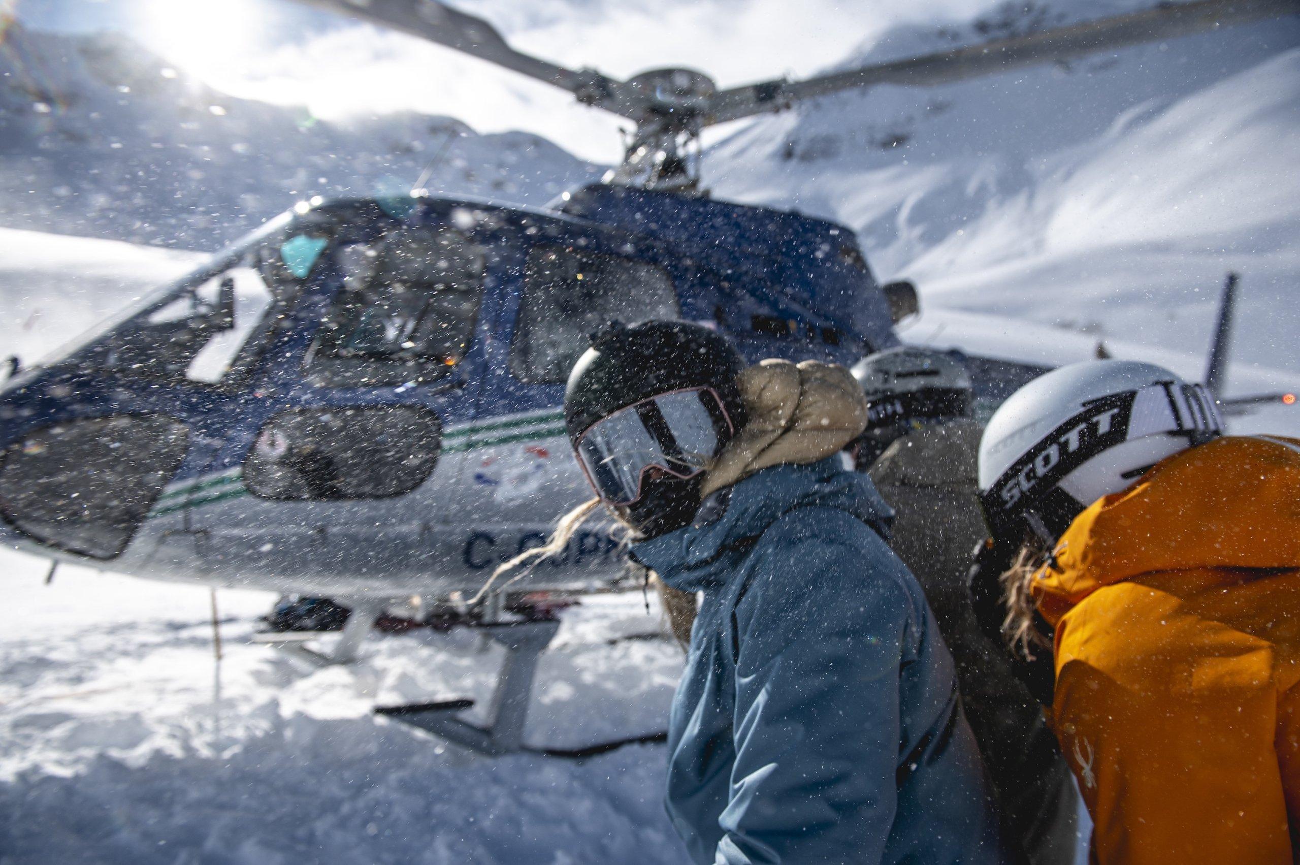 Group in front of helicopter