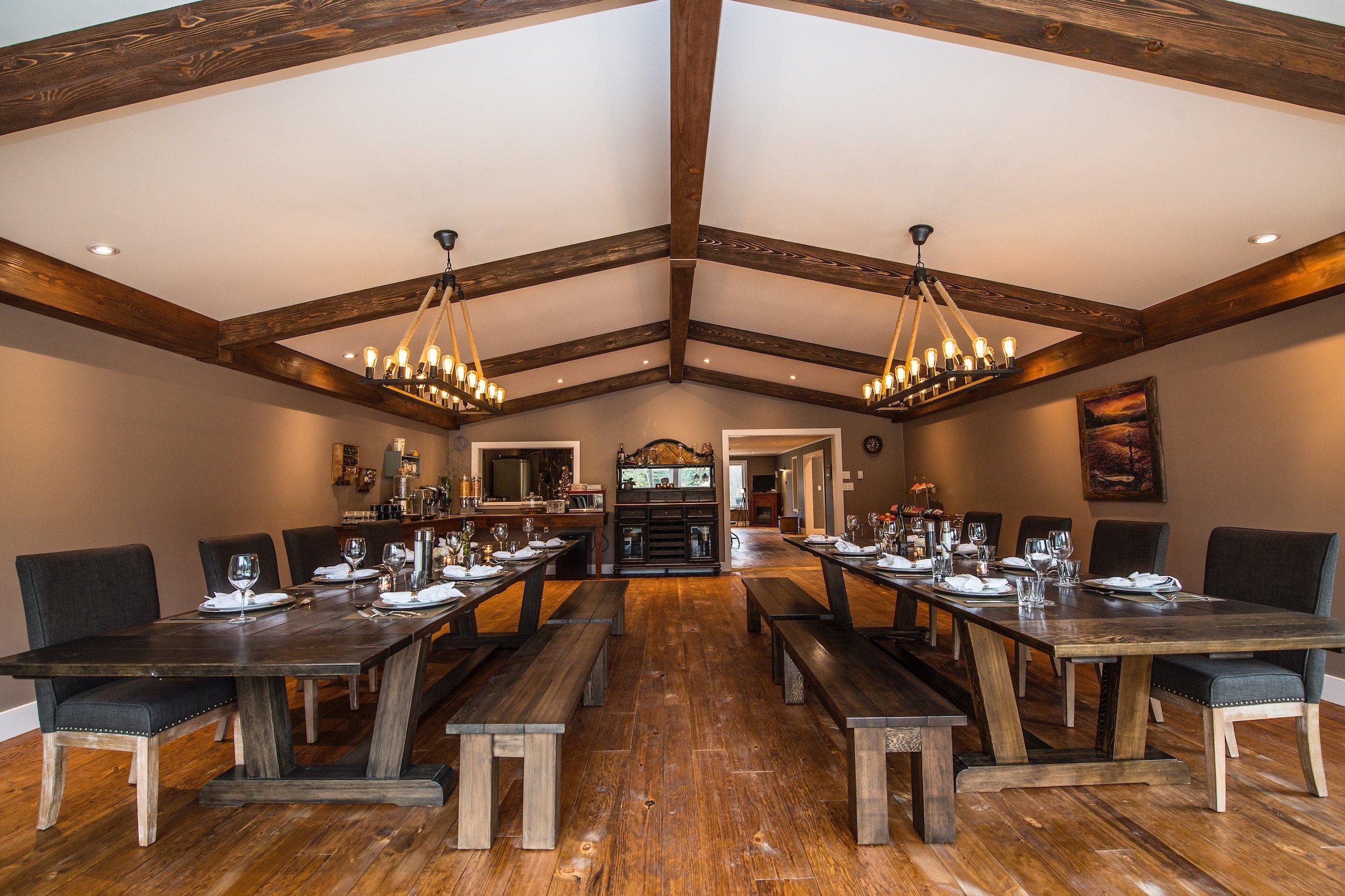 Large dining area with two long wooden tables