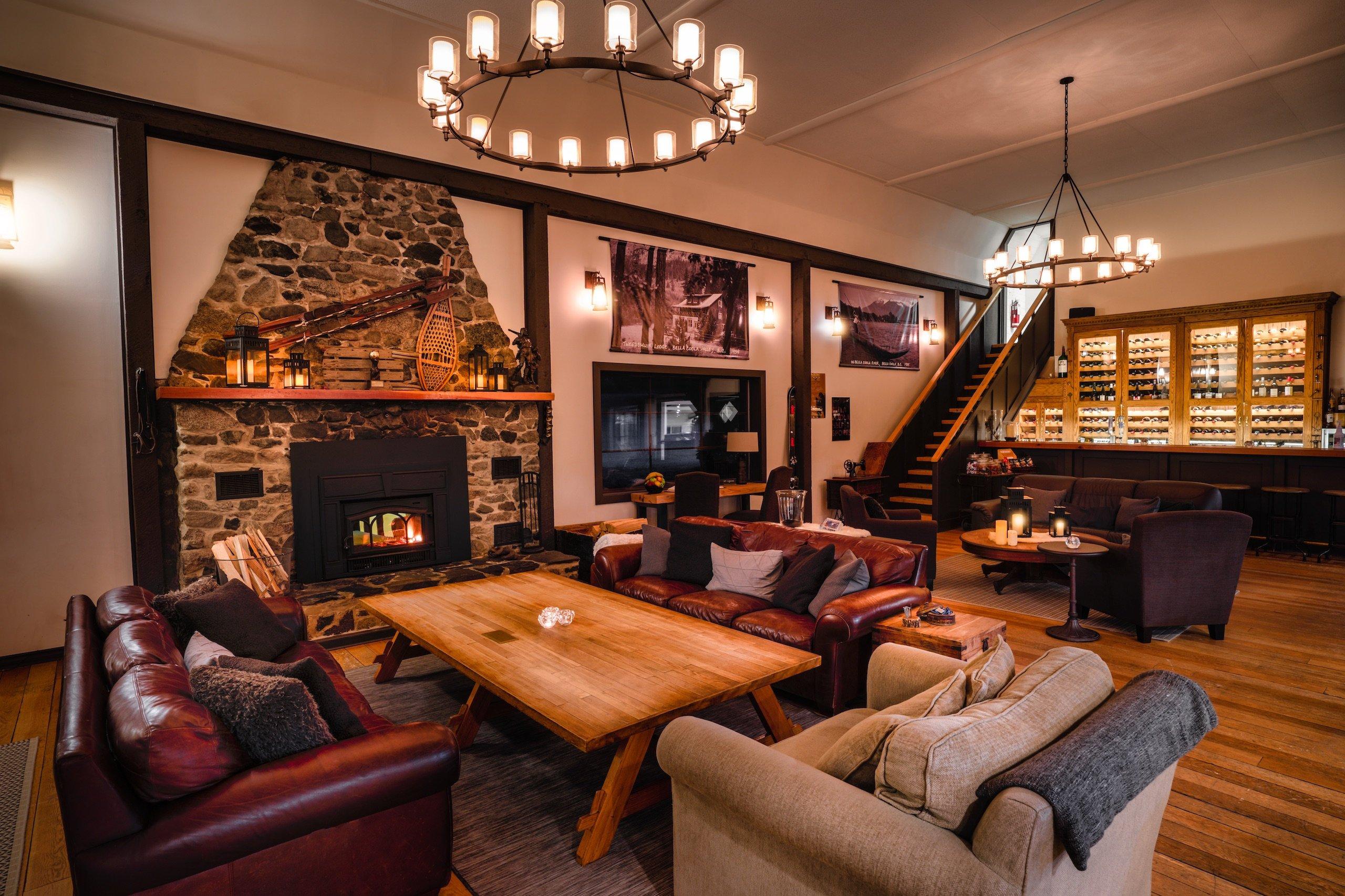 Lounge area with a stone fireplace and bar