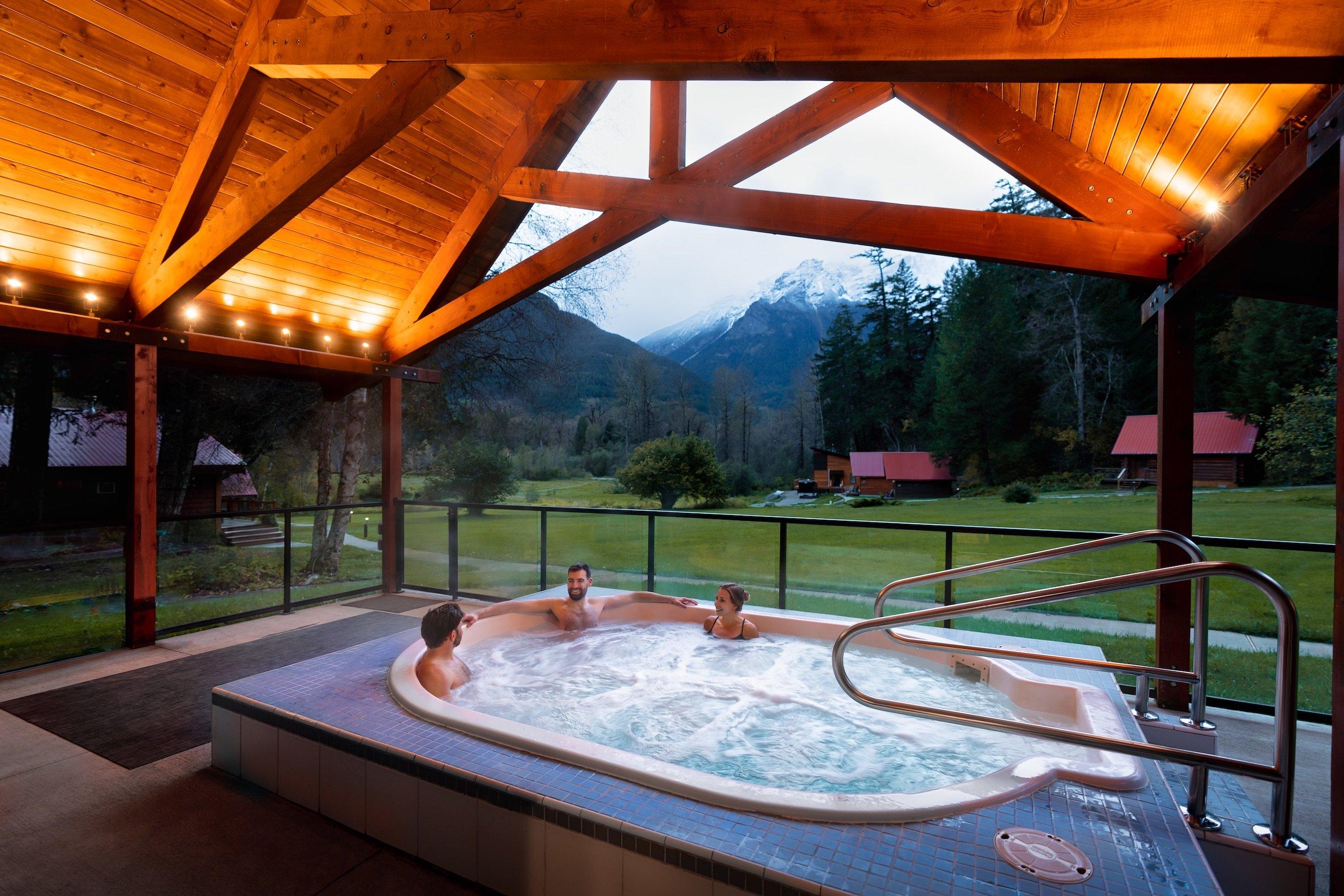 three friends in an outdoor hot tub